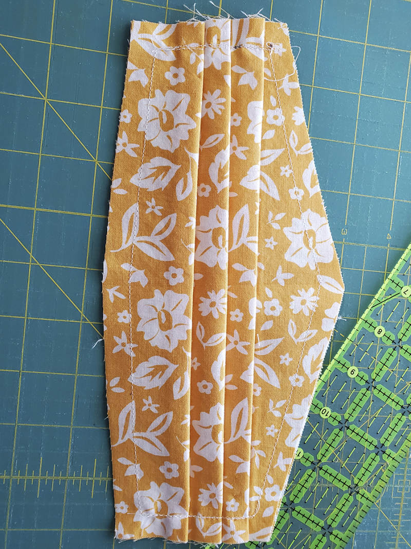 Corona masks pleats up Corona masks pleats up