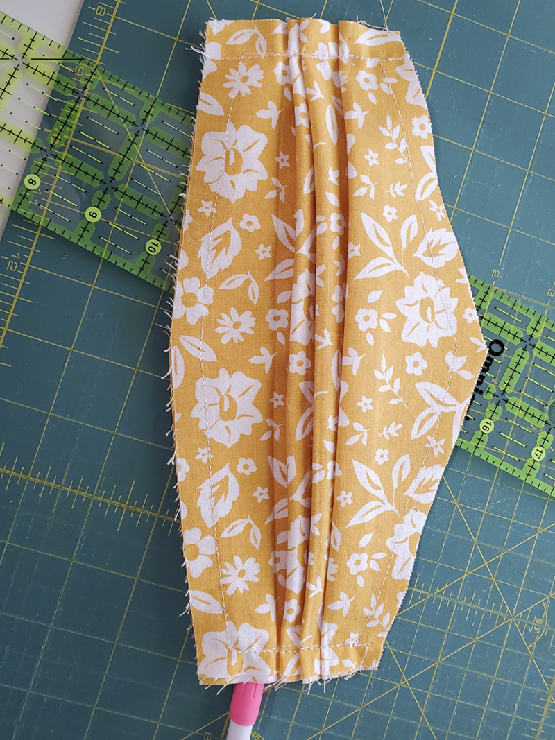 Corona masks pleats down Corona masks pleats down